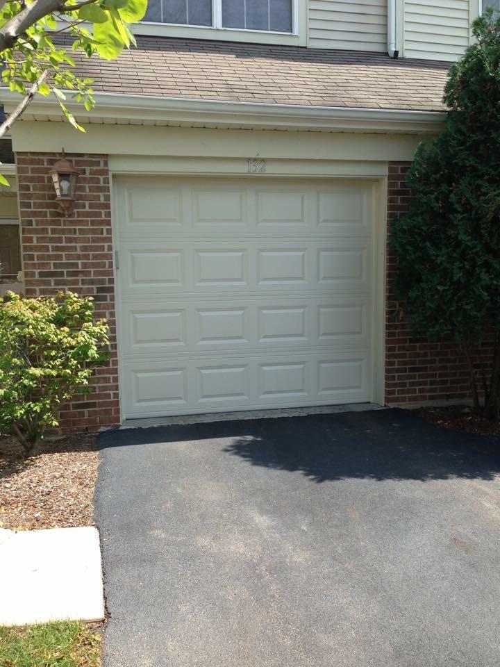 Short panel traditional garage door with no indows 