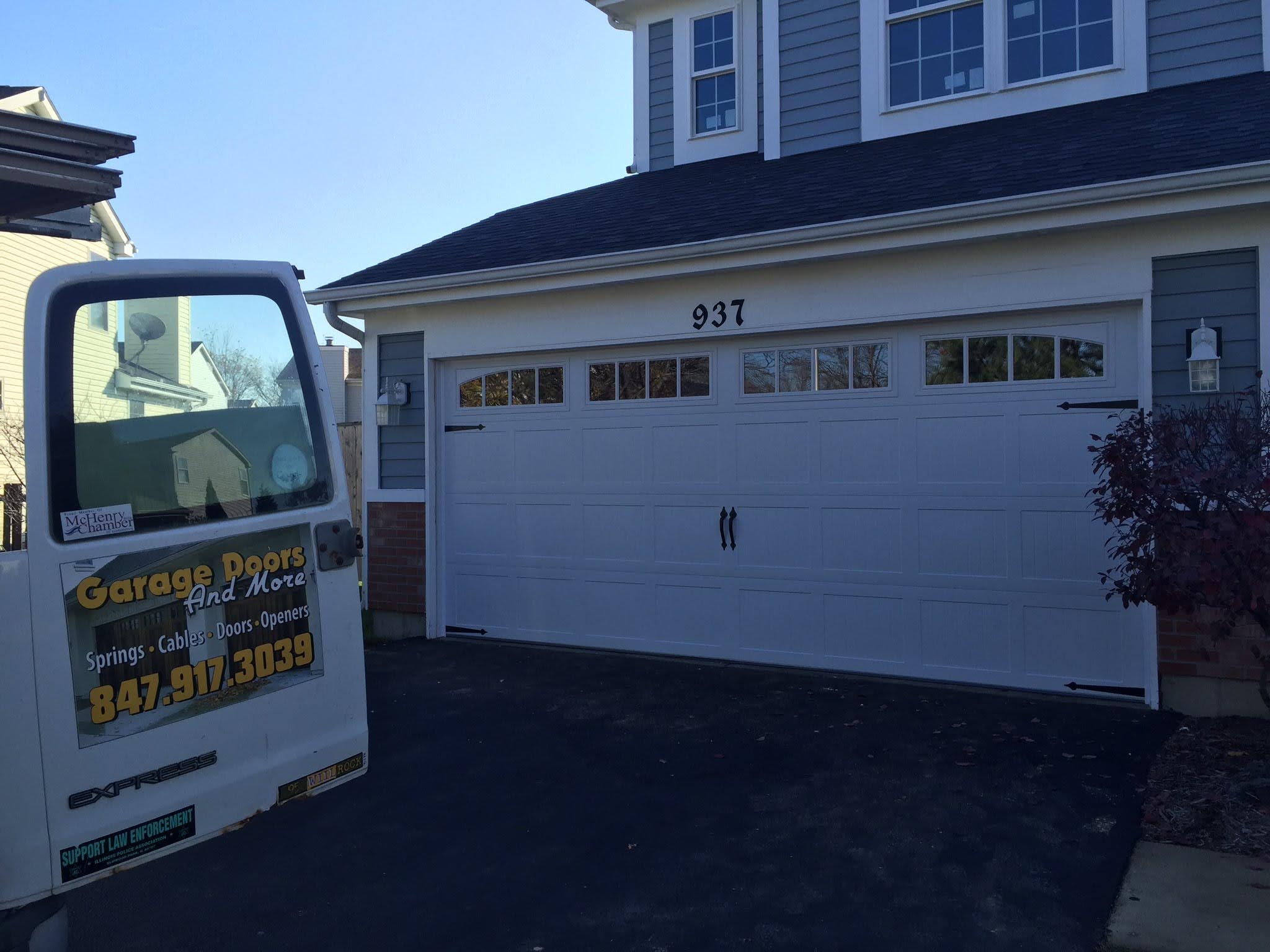 New garage door installation with a Garage Doors and More service truck